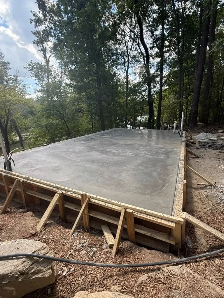 Finished concrete slab on a wooded residential lot