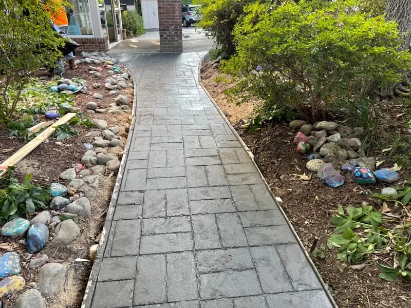 Stamped concrete path through a garden