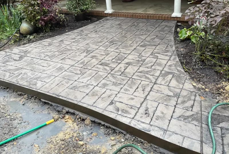 Stamped concrete walkway to a porch